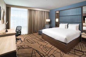 spacious king room with work desk and TV at Hilton Garden Inn Bogota Airport.