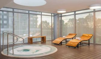 relaxing indoor jacuzzi with pool beds at Hilton Garden Inn Bogota Airport.