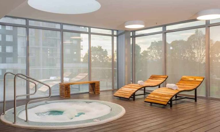 relaxing indoor jacuzzi with pool beds at Hilton Garden Inn Bogota Airport.