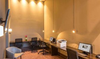 dedicated business center with PC, internet, work desks, and printer at Hilton Garden Inn Bogota Airport.