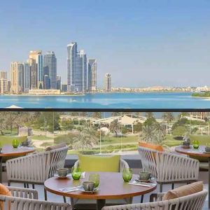 lovely outdoor terrace with gorgeous water/city views ideal as a coworking space at DoubleTree by Hilton Sharjah Waterfront Hotel & Residences.