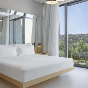 spacious king room with lots of natural light at Susona Bodrum, LXR Hotels & Resorts.