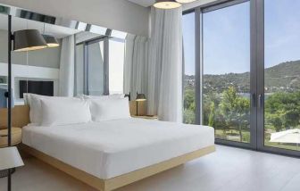 spacious king room with lots of natural light at Susona Bodrum, LXR Hotels & Resorts.