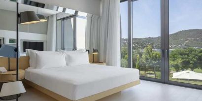 spacious king room with lots of natural light at Susona Bodrum, LXR Hotels & Resorts.