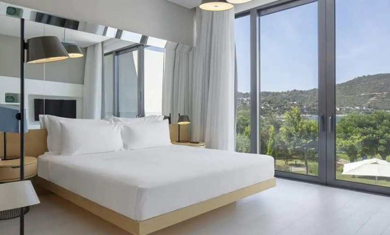 spacious king room with lots of natural light at Susona Bodrum, LXR Hotels & Resorts.