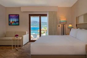 beautiful king suite with lounge and sea views at DoubleTree by Hilton Bodrum Isil Club Resort.