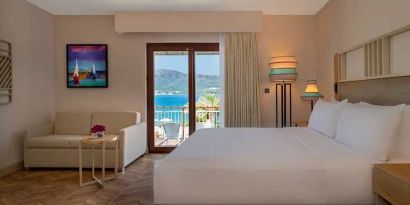 beautiful king suite with lounge and sea views at DoubleTree by Hilton Bodrum Isil Club Resort.