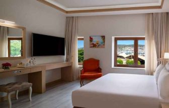 stunning king room with TV, work area, and beautiful sea views at DoubleTree by Hilton Bodrum Marina Vista.