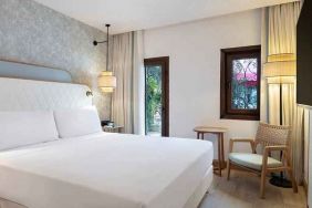 comfortable delux king room with TV and natural light at DoubleTree by Hilton Bodrum Marina Vista.