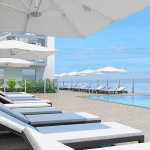 Relaxing outdoor pool area with lounges at the Hilton Garden inn Casablanca Sud.