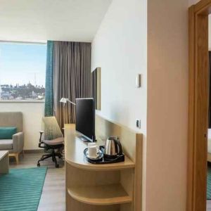 Hotel suite with living room and king size bed at the Hilton Garden Inn Tanger City Center.