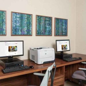 Business center with computers and printer at the Hilton Garden Inn Tanger City Center.