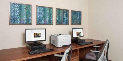 Business center with computers and printer at the Hilton Garden Inn Tanger City Center.