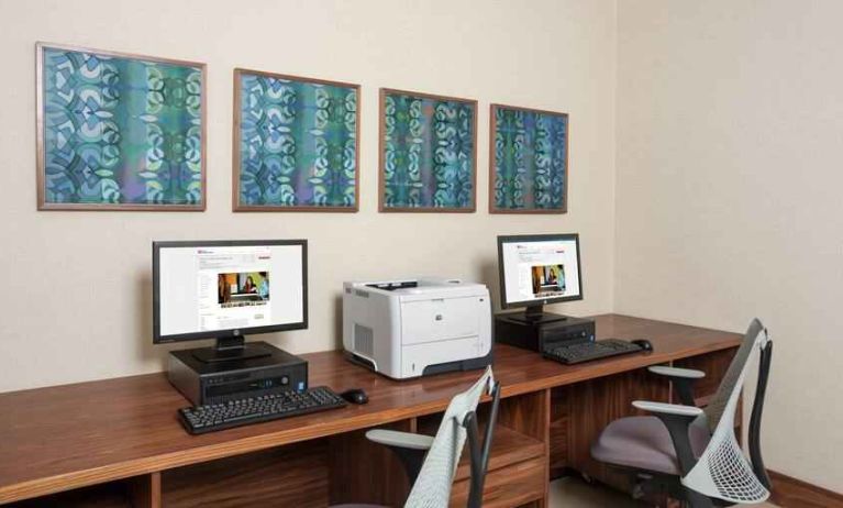 Business center with computers and printer at the Hilton Garden Inn Tanger City Center.