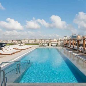 stunning outdoor pool with sun beds at Hilton Istanbul Bomonti Hotel & Conference Center.