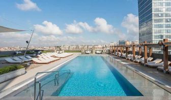 stunning outdoor pool with sun beds at Hilton Istanbul Bomonti Hotel & Conference Center.