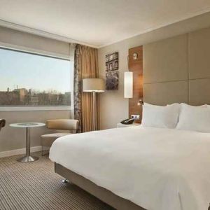 spacious king room with TV and work desk at Hilton Barcelona.