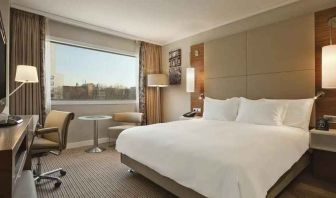 spacious king room with TV and work desk at Hilton Barcelona.