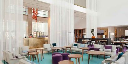 comfortable lobby and coworking space with lots of natural light at Hilton Barcelona.