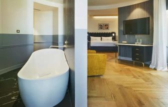 luxurious suite with relaxing bath tub at Casa Alberola Alicante, Curio Collection by Hilton.