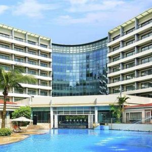 stunning outdoor pool with sunbeds at Hilton Guangzhou Science City.