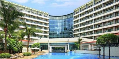 stunning outdoor pool with sunbeds at Hilton Guangzhou Science City.