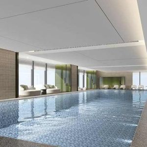 beautiful indoor pool large enough to do laps, surrounded by sun beds at DoubleTree by Hilton Kunming Airport.