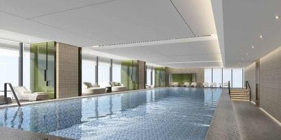 beautiful indoor pool large enough to do laps, surrounded by sun beds at DoubleTree by Hilton Kunming Airport.