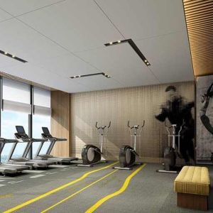 well equipped fitness center with lots of natural light at DoubleTree by Hilton Kunming Airport.