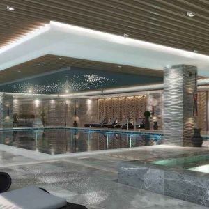 luxurious indoor pool surrounded by sunbeds at DoubleTree by Hilton Manisa.