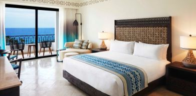 King bedroom with working station overlooking the ocean at the Hilton Los Cabos Beach & Golf Resort.