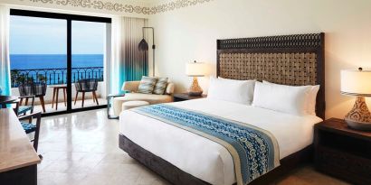 King bedroom with working station overlooking the ocean at the Hilton Los Cabos Beach & Golf Resort.