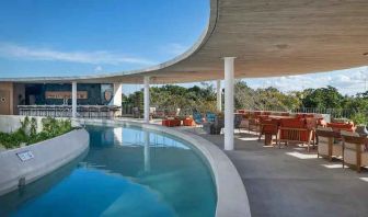 Relaxing outdoor pool at the Hilton Garden Inn Cancun Airport.