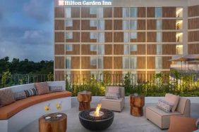 Terrace with firepit suitable for co-working at the Hilton Garden Inn Cancun Airport.