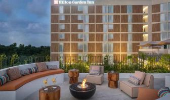 Terrace with firepit suitable for co-working at the Hilton Garden Inn Cancun Airport.