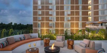 Terrace with firepit suitable for co-working at the Hilton Garden Inn Cancun Airport.