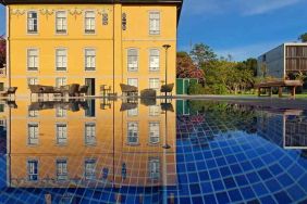 Outdoor patio suitable for co-working at the Boeira Garden Hotel Porto Gaia, Curio Collection by Hilton.