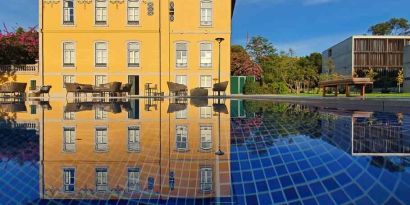 Outdoor patio suitable for co-working at the Boeira Garden Hotel Porto Gaia, Curio Collection by Hilton.