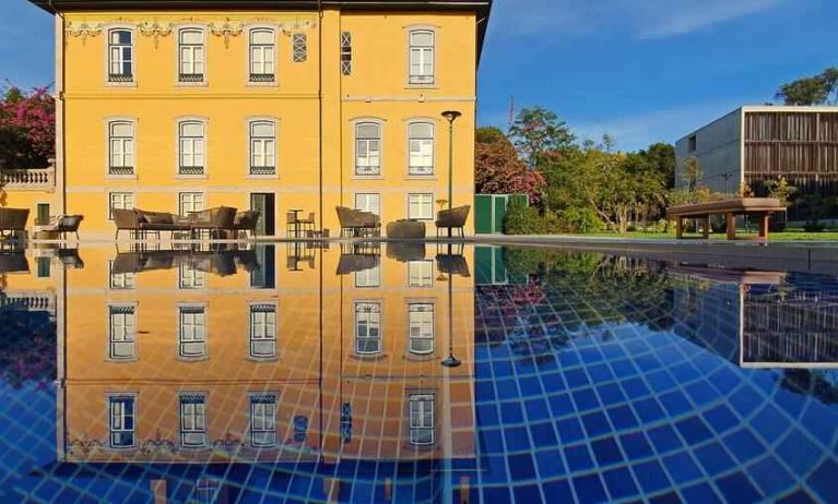 Outdoor patio suitable for co-working at the Boeira Garden Hotel Porto Gaia, Curio Collection by Hilton.