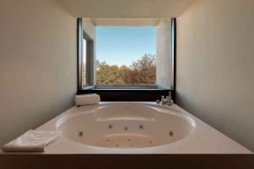 Bath tub at the Boeira Garden Hotel Porto Gaia, Curio Collection by Hilton.