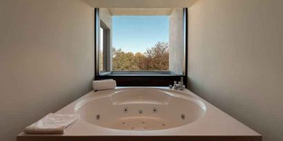 Bath tub at the Boeira Garden Hotel Porto Gaia, Curio Collection by Hilton.