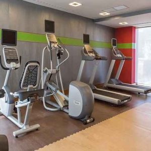 well equipped fitness center with treadmills and weights at Hampton by Hilton Samsun.