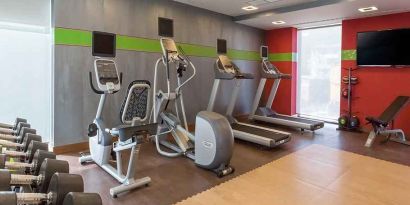 well equipped fitness center with treadmills and weights at Hampton by Hilton Samsun.