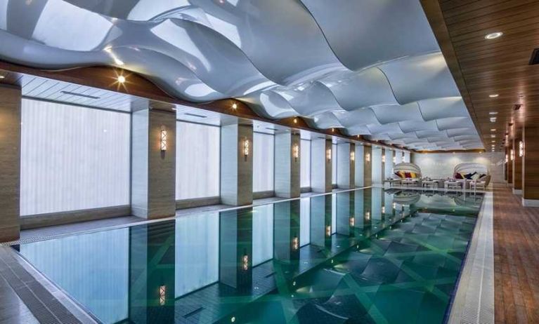 lovely indoor pool with seating area at DoubleTree by Hilton Istanbul Topkapi.