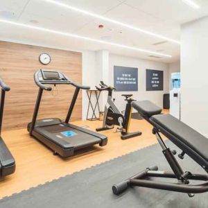 Fitness center with treadmills at the Hampton by Hilton Warsaw Reduta.