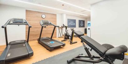 Fitness center with treadmills at the Hampton by Hilton Warsaw Reduta.