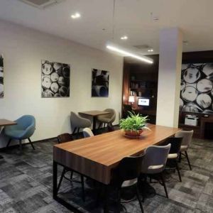 Hotel workspace with large table at the Hampton by Hilton Gdansk Old Town.