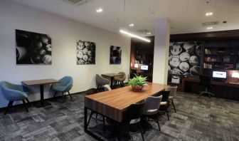 Hotel workspace with large table at the Hampton by Hilton Gdansk Old Town.