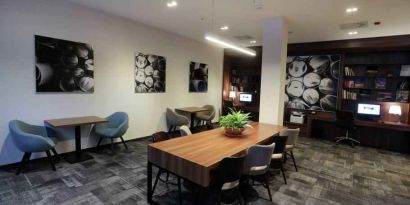 Hotel workspace with large table at the Hampton by Hilton Gdansk Old Town.