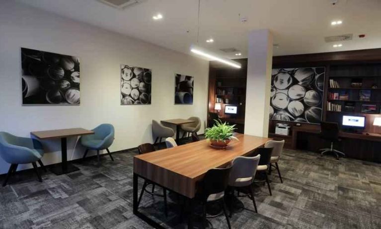 Hotel workspace with large table at the Hampton by Hilton Gdansk Old Town.